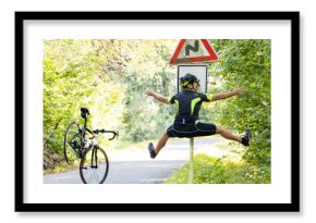 A falling cyclist bumps into a road sign warning about road with turns.