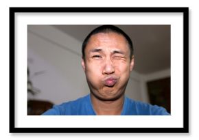 Asian father making funny faces  