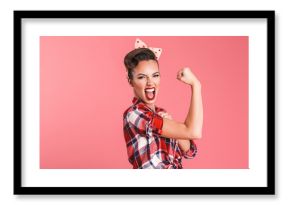 Gorgeous strong young pin-up woman showing biceps.