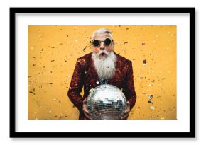 Crazy senior man having fun doing party during holidays time - Elderly people celebrating life concept