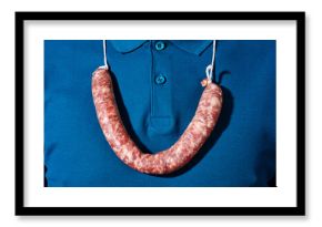 man wears a raw sausage as a necklace