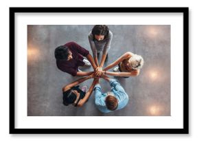 Young people making a stack of hands