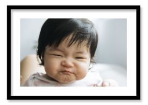 Baby girl making funny face