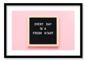 Every day is a fresh start. Motivational quote on black letter board on pink background. Concept inspirational quote of the day. Greeting card, postcard.