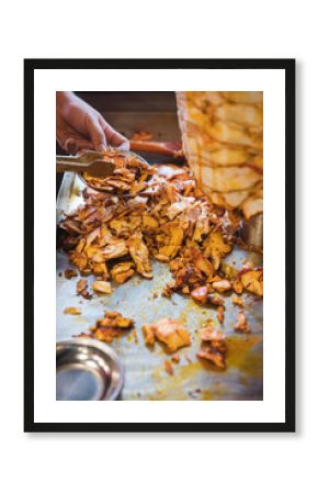 Chef preparing and making Traditional Turkish Doner Kebab meat. Shawarma or gyros. Turkish, greek or middle eastern arab style chicken doner kebab food on isolated white.