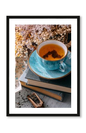 tea and a book in the spring sunshine. near honey and flowers