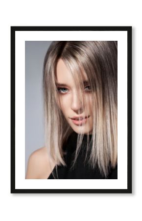 Woman with colored hair color of a blonde. Coloring hair woman model in ash color. Portrait of a girl