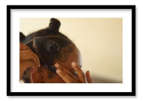 close up of a young woman laying her hair edges down