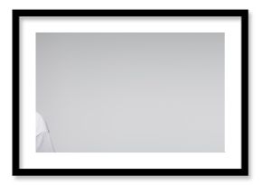 colorist in latex gloves holding comb near long hair of client isolated on grey, banner