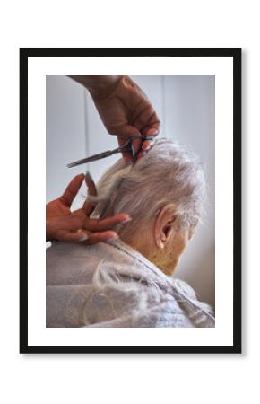 caregiver, cutting her elderly woman hair