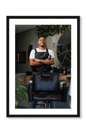 Latin American barber in his own business. Young entrepreneur at his work. Happy Colombian stylist at his barbershop. Passionate person who enjoys what he does for a living. Employment opportunities