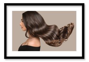 woman shiny long wavy hair up. side view. grey background