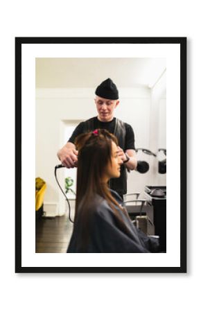 Hairdresser working on woman's hair