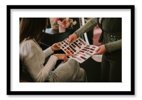 Pointing at the color palette at the hair salon