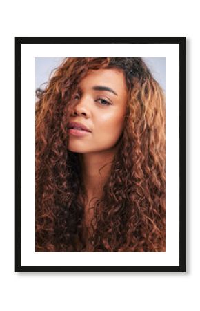 Portrait, woman and curls, hair and studio, healthy or haircare with beauty for natural texture, growth and change. Confident, person and cosmetics, shine or results for glow in white background