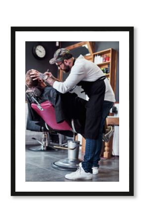 Beard, razor and barber with client for shave, haircut and grooming for hygiene, wellness or cosmetics. Barbershop, hairdresser parlor and man with shaving cream, foam and blade for hair service