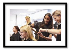 Teacher Helping Students Training To Become Hairdressers