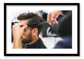 Barber using scissors and comb