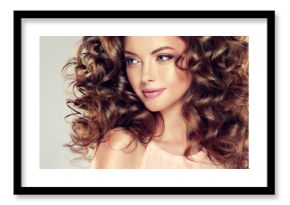 Beautiful model girl with  wavy  hairstyle  . Brunette woman with long  curly hair