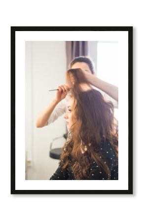 beauty and people concept - happy young woman with hairdresser at hair salon.