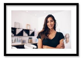 Female hairdresser standing in salon