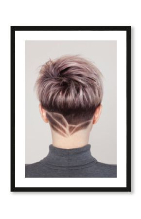 Portrait of a beautiful blonde woman with beautiful make-up and short haircut after dyeing hair in a hairdressing salon.