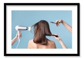 Woman getting a haircut and blow drying her hair