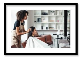 Young woman looking for changes, trying new hairstyle at beauty salon