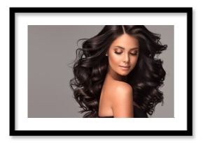 Beauty brunette girl with long  and   shiny wavy black hair .  Beautiful   woman model with curly hairstyle .