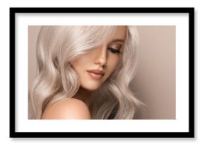 Beautiful girl with hair coloring in ultra blond. Stylish hairstyle curls done in a beauty salon. Fashion, cosmetics and makeup