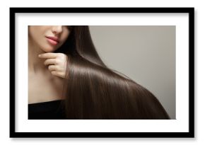 Brunette woman showing straight shiny hair