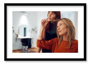 Woman, hair salon and hair barber with client or customer for haircut choice. Hair care, hairstyle and professional female hairdresser or small business owner giving haircare advice to female or lady