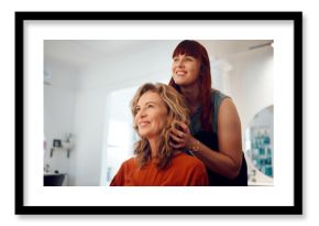 Hairdresser, senior woman client and hair care consultation with young hairstylist in training. Happy customer, stylish hairstyle cosmetic treatment and luxury beauty salon professional worker