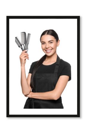 Portrait of happy hairdresser with professional tools on white background