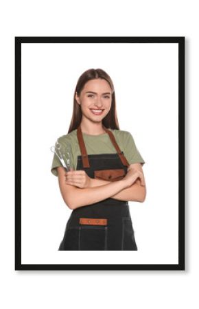 Portrait of happy hairdresser with professional scissors on white background