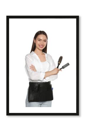 Portrait of happy hairdresser with brushes on white background