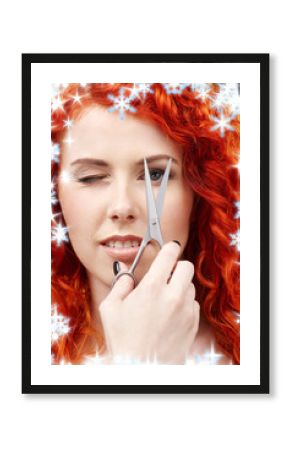 picture of lovely redhead with scissors and snowflakes