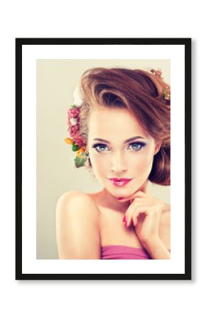Spring girl with flowers in her hair and fashion makeup