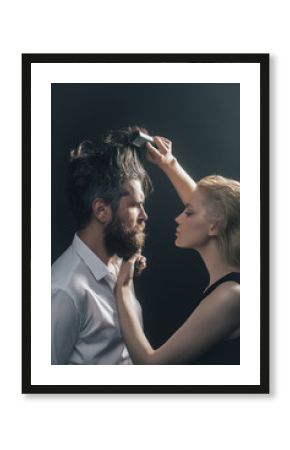 blonde hairdresser combing bearded man