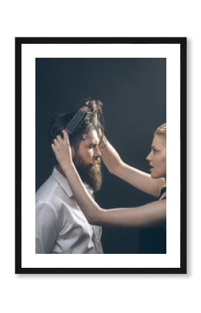 blonde hairdresser combing bearded man