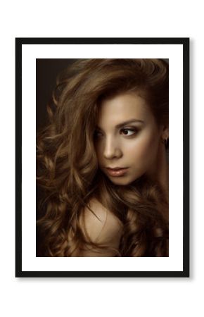   Portrait of a young beautiful brunette girl with long  hair  