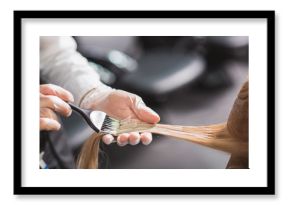 Man in gloves is dying hair