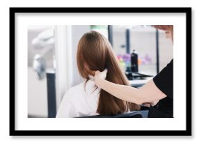 Closeup hairdresser coiffeur makes hairstyle.