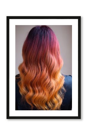 Woman with bright color dyed long curly hair