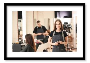 Portrait of female hairdresser in salon