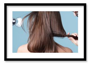 Woman getting a haircut and blow drying her hair