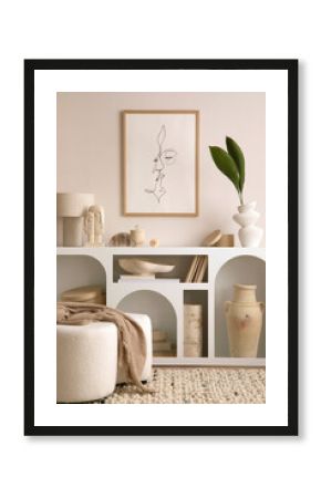 Creative composition of living room interior with white commode, boucle pouf, poster mock up frame, decoration, books and personal accessories. Cozy  home decor. Template. 