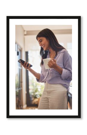 Happy woman, phone and coffee or tea at home while online for communication or social media and laughing at funny joke or meme. Female in her India house with smartphone for ecommerce or dating app