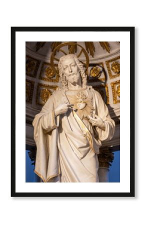 BELLANO, ITALY - JULY 20, 2022: The carved polychrome statue of Heart of Jesus from main altar of the church Chiesa dei santi Nazareo e Celso from 19. cent.