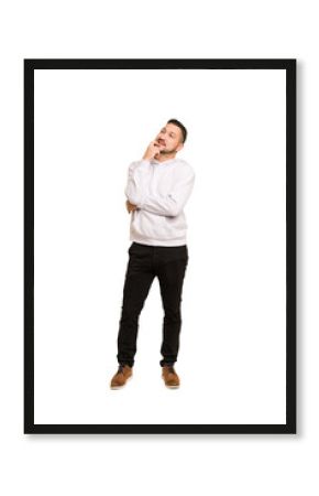 Full body adult latin man cut out isolated relaxed thinking about something looking at a copy space.